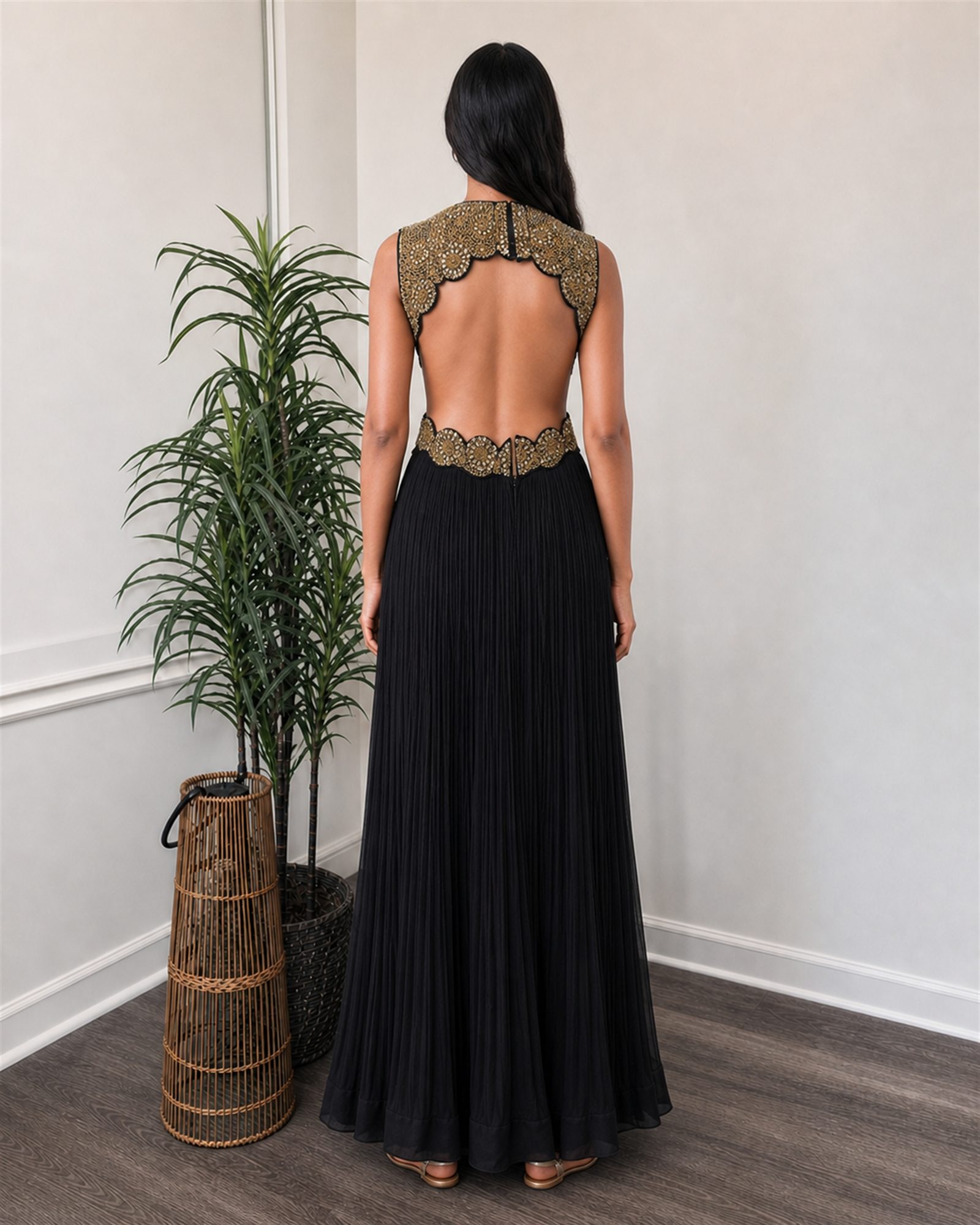 Black and gold antique-work evening gown, open back with scalloped embroidered yoke and waistband