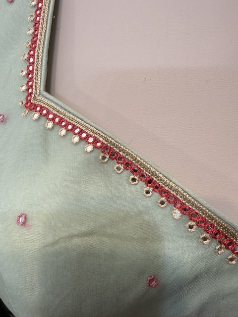 Blush georgette lehenga with halter blouse, lehenga embroidery detail