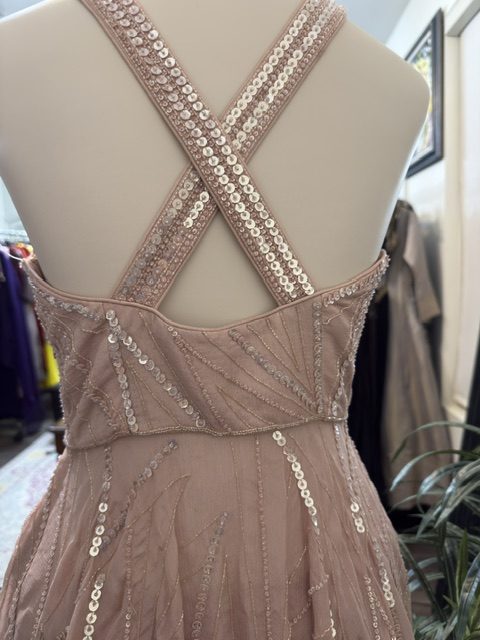 Blush pink asymmetric top with skirt, crossed strap back detail