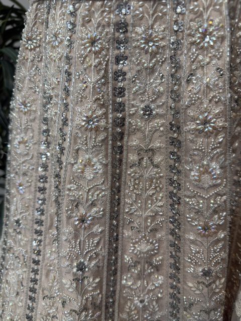 Blush tissue bridal lehenga, pearl and thread embroidery in vertical panels on the skirt