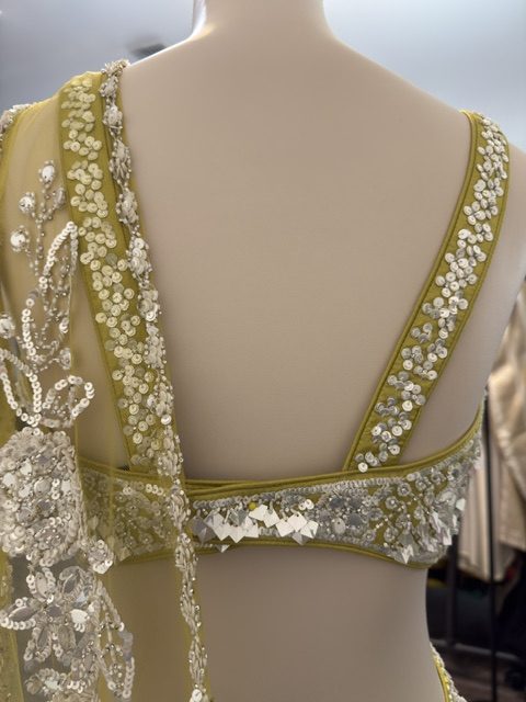 Chartreuse draped lehenga with sequined blouse, beaded back detail