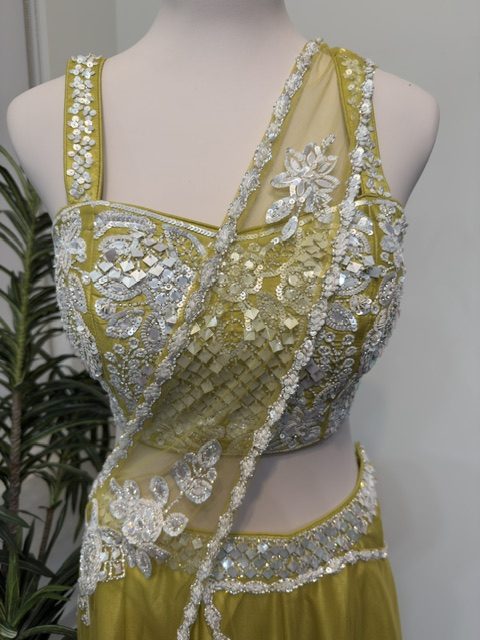 Chartreuse draped lehenga with sequined blouse, sequin and mirror work detail