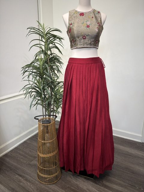 Grey tissue crop top with red pleated skirt, full view