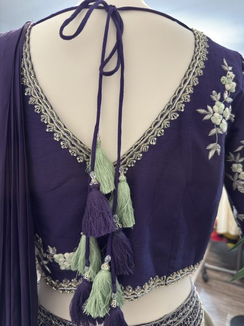 Grey tissue draped lehenga with embroidered blouse, tasselled tie back detail