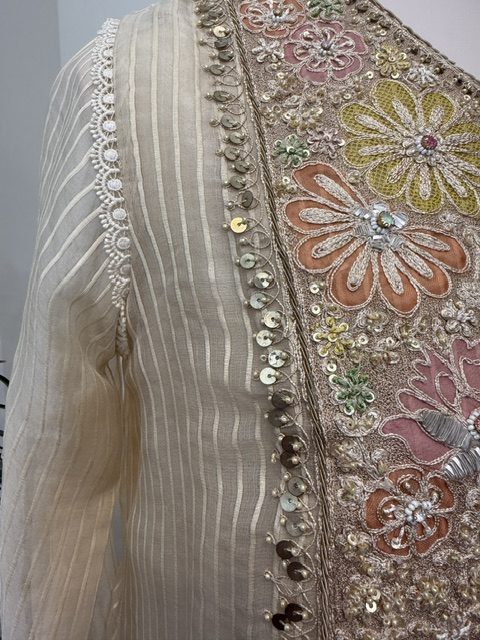 Ivory chanderi kurta, lace trim beside the embroidered panel