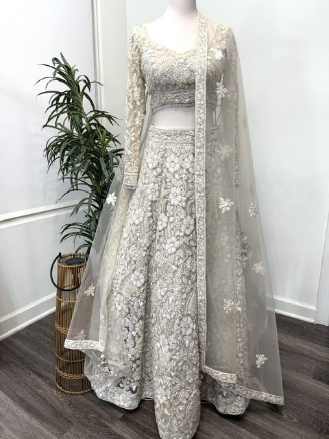 Ivory net bridal lehenga with embroidered blouse and net dupatta, full view