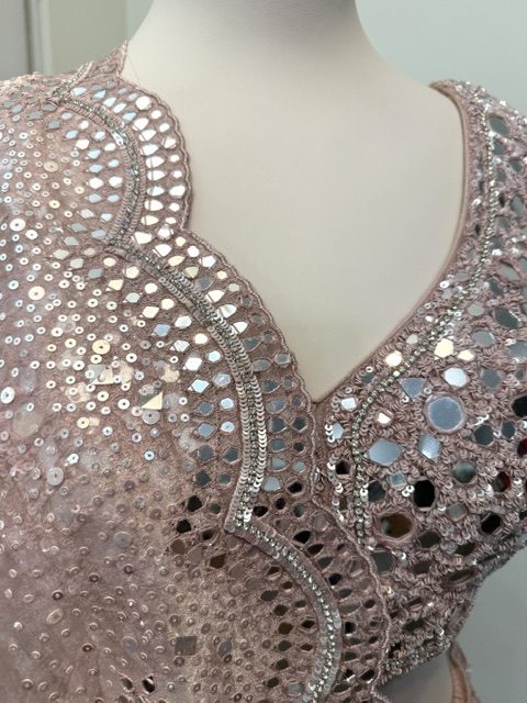 Pink tissue bridal lehenga, scalloped V neckline and mirror work on the blouse
