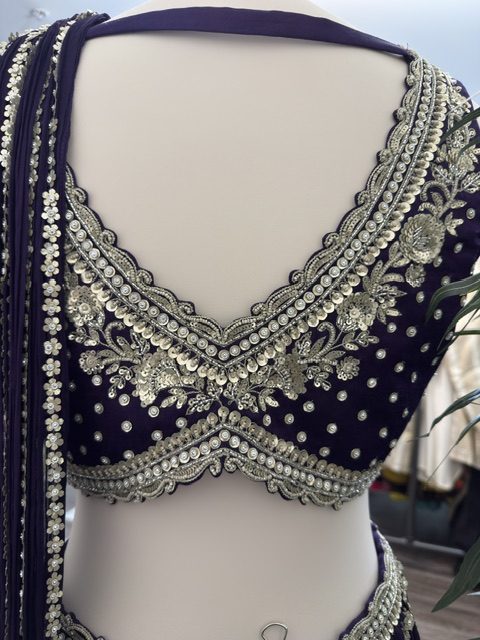 Purple draped lehenga with embroidered blouse, embroidered back detail