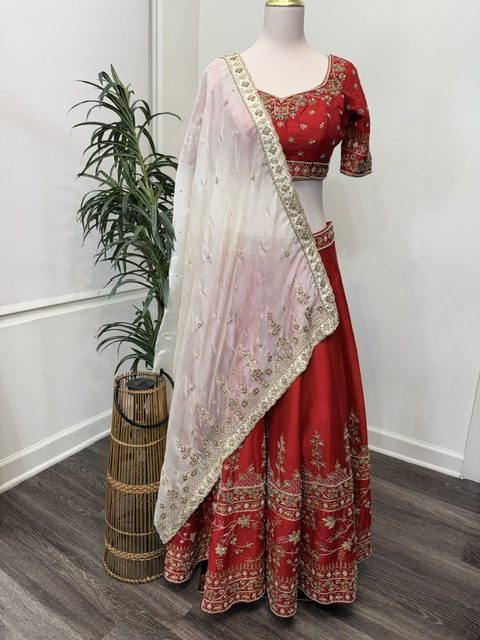 Red raw silk bridal lehenga with embroidered blouse and ivory-to-pink silk dupatta, full view