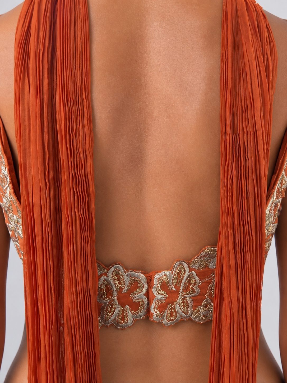 Rust orange embroidered top, open back with scalloped floral embroidered band