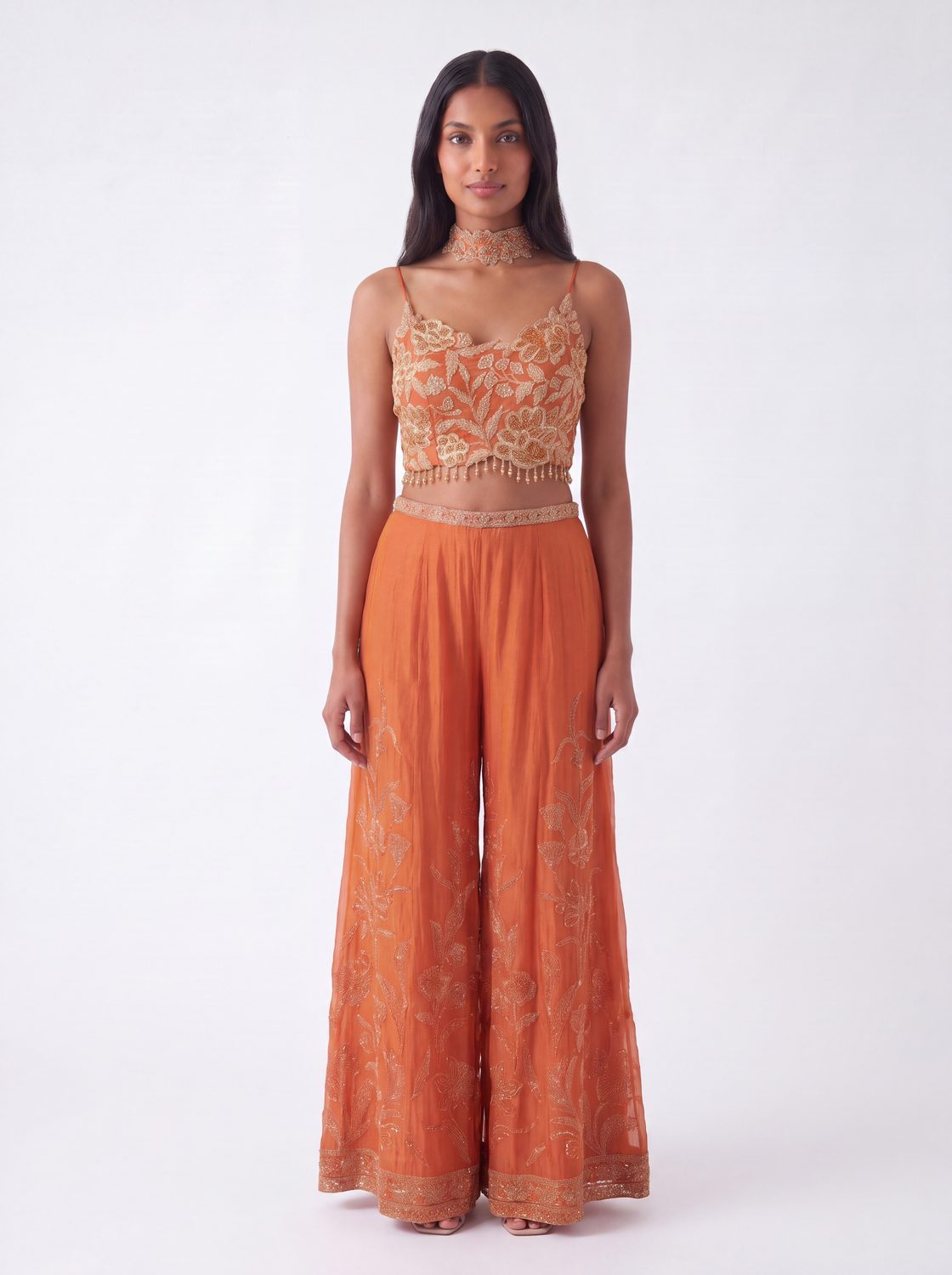 Rust orange embroidered crop top with matching wide-leg georgette pants, full view