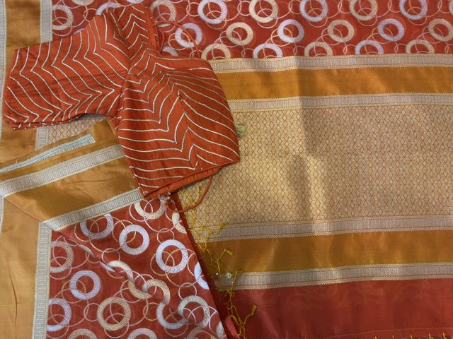 Rust orange saree with circle motif, full view
