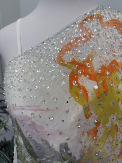 White printed top, sequin and hand-painted floral detail at the shoulder