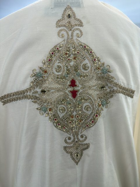 White silk kaftan, embroidered back motif detail