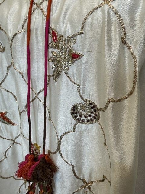 White silk kaftan, hand embroidery and tassel detail